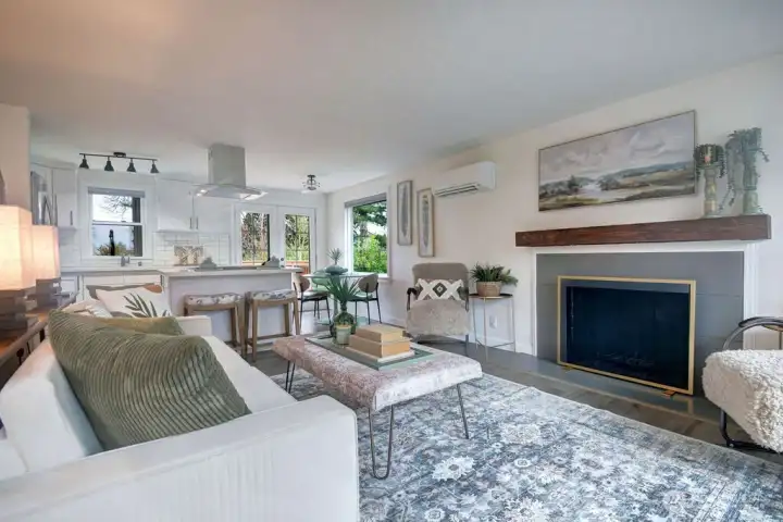 Bright Living room with wood burning fireplace