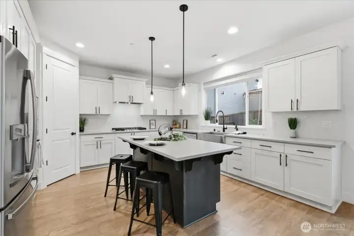 Kitchen, island, quartz counters, stainless appliances