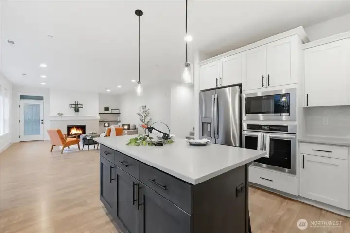 Kitchen, great room, kitchen island, quartz counters, built-in oven