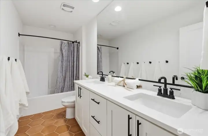 Full bathroom on upper, w/ double vanity