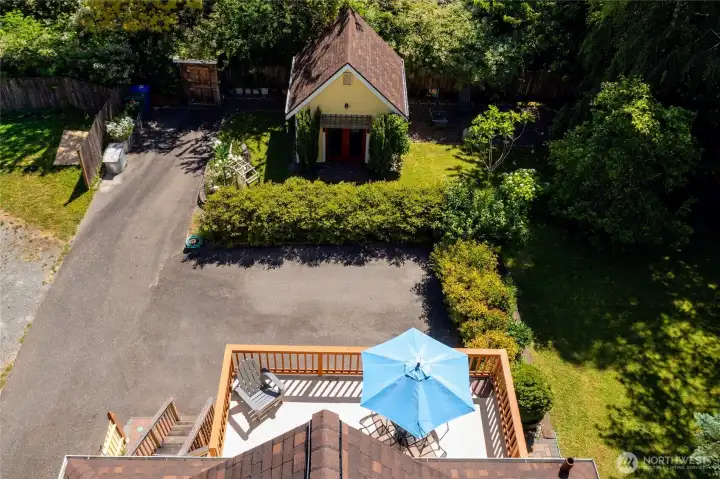 Parking pad that fits 2 cars and an overview of the deck and shed