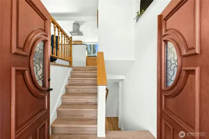 This inviting entry highlights the new luxury vinyl tile flooring.