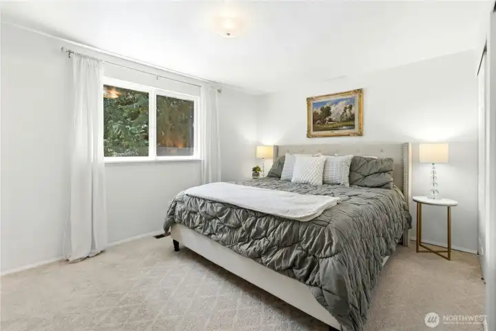The primary suite on main floor has a large reach-in closet and an adjoining 3/4 tile bath.
