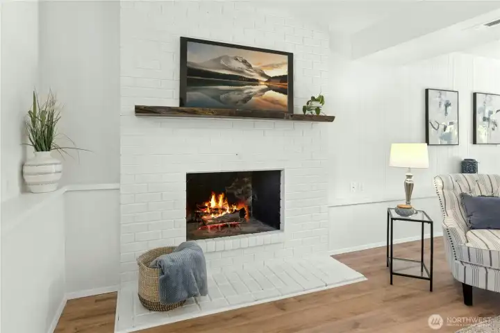 Here's a closer look at the fireplace with brick surround.