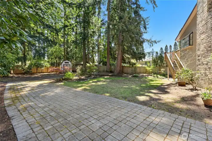Here is the side yard. Note stairs on the right go up to the deck.