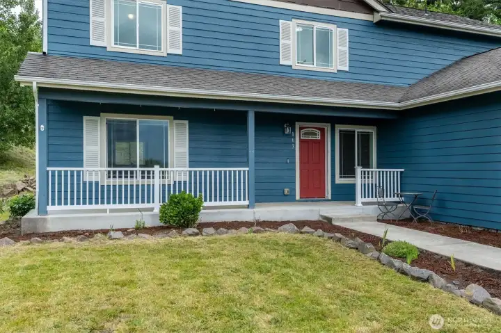 Large welcoming porch Just need a swing