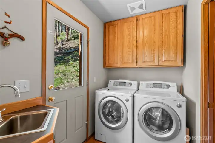 Separate laundry room has door to outside to "drop" the dirty clothes on your way in on the main floor.