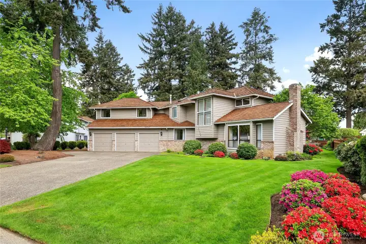Welcome home! Beautiful curb appeal featuring a convenient circular driveway.