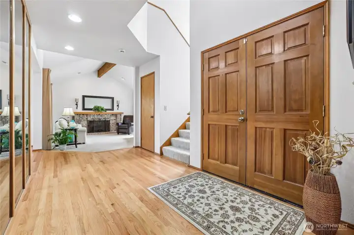 Bright and airy foyer leading into the main living areas.