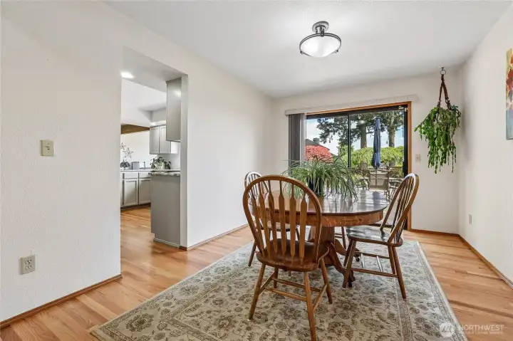 Formal dining room flows seamlessly to the kitchen or back deck for easy entertaining.
