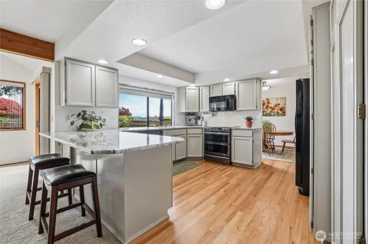 Stylish cabinetry and gorgeous hardwood flooring throughout the main level.