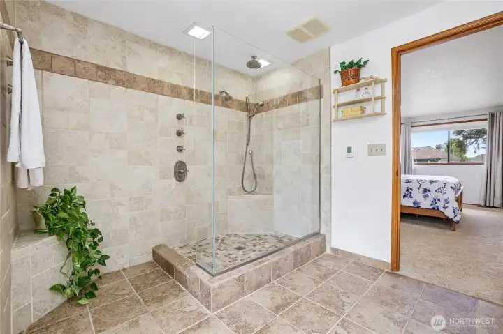 Spa-like primary shower featuring 3 distinct showerhead options