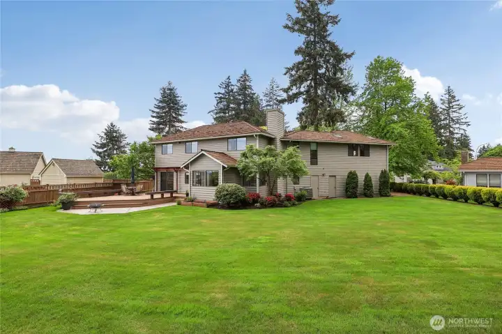 Stunning park-like yard with lush, professional landscaping and automatic sprinklers.
