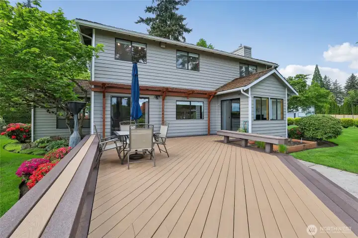 Expansive Trex deck with built-in benches: your front-row seat to the manicured grounds.