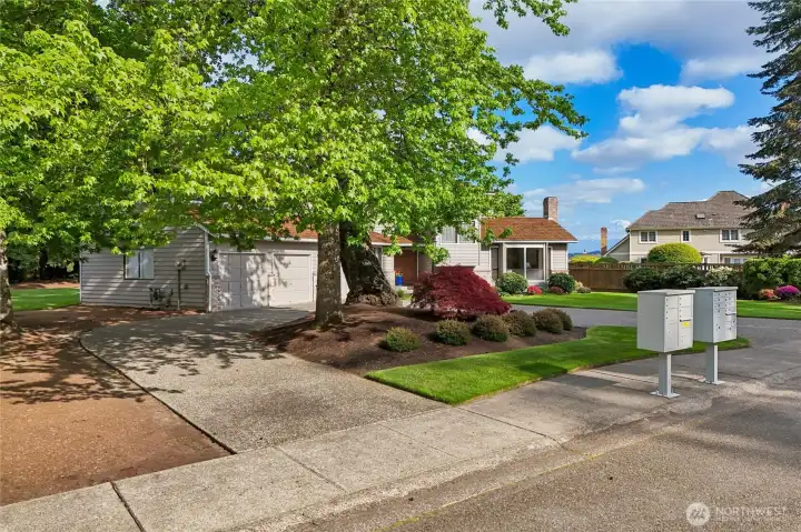 Convenient circular driveway and mature trees that provide stunning fall colors.