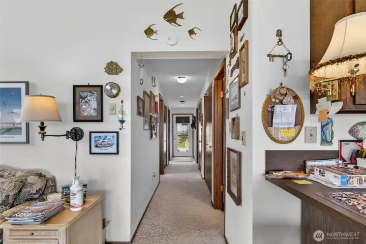 Hall to bedrooms, bathrooms, laundry and front door.
