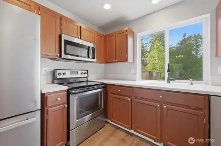 Kitchen Sink looks out to Private Backyard.