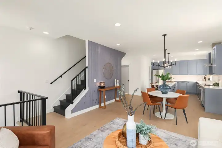 Spacious dining and living room with direct access to the covered deck overlooking the fully fenced front yard