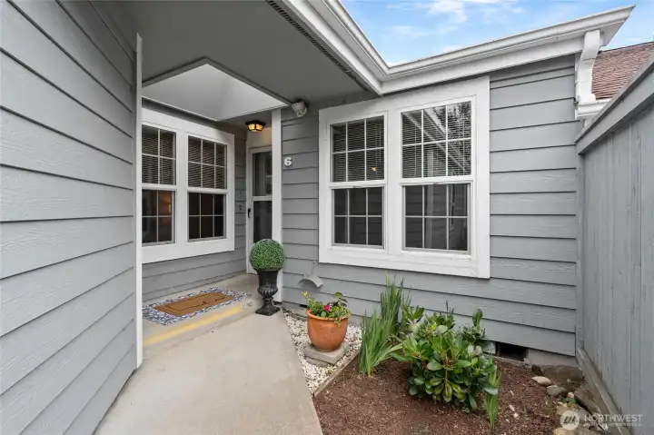 Covered front porch gleams under a skylight