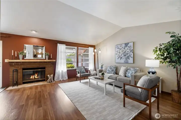 opening to vaulted ceilings and spacious living room