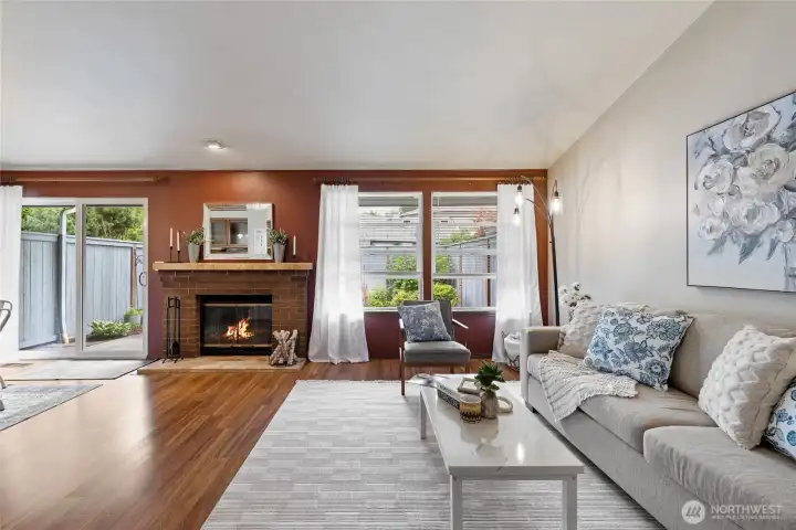 Wood burning FP is adorned by beautiful brick and mantle