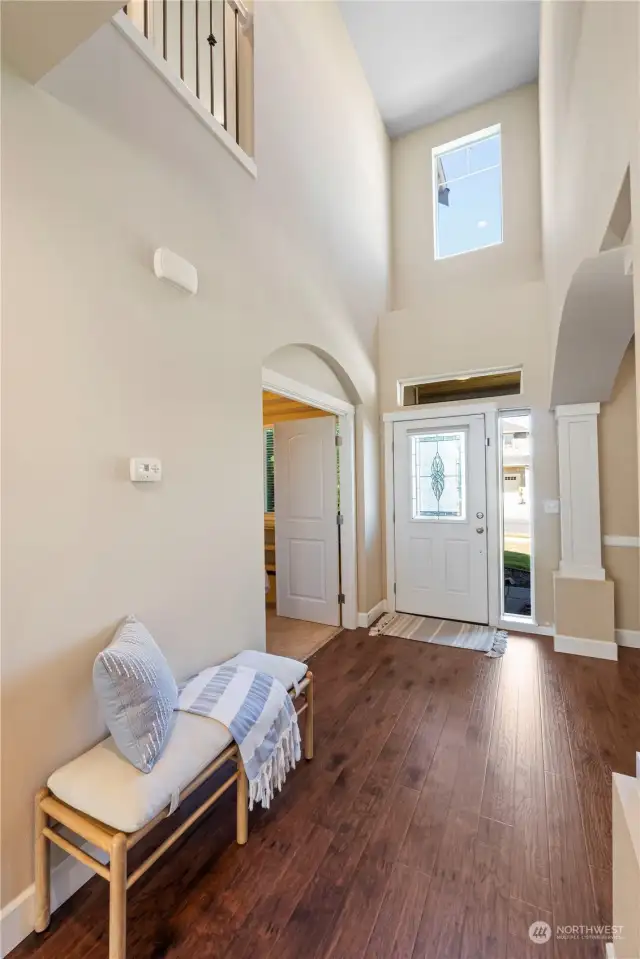 Entry with den/4th bedroom to the right and flex space/formal dining to the left.