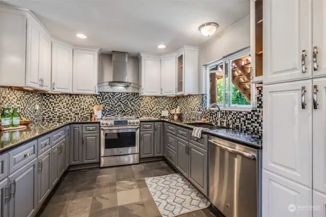 Gorgeous mosaic backsplash, soft-close cabinets, stainless steel appliances and abundant storage and counter space!
