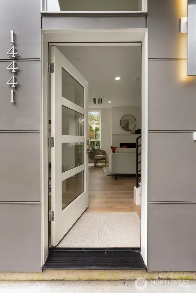 The private entrance offers a quiet retreat into your sanctuary, where modern elegance meets thoughtful design.