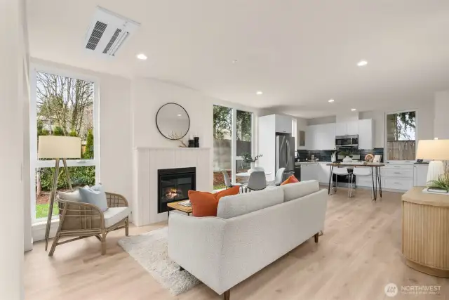 An open floor plan connects the living room, dining area, and kitchen, making this space ideal for entertaining and everyday living. The modern finishes and abundant light elevate every moment spent here.