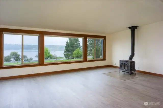 Great room with wood stove and panoramic view of Fisherman Bay