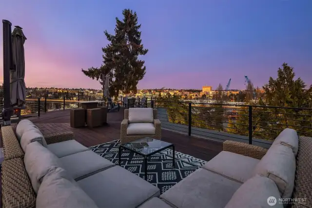 Spacious rooftop deck with variety of seating areas, all with stunning views.
