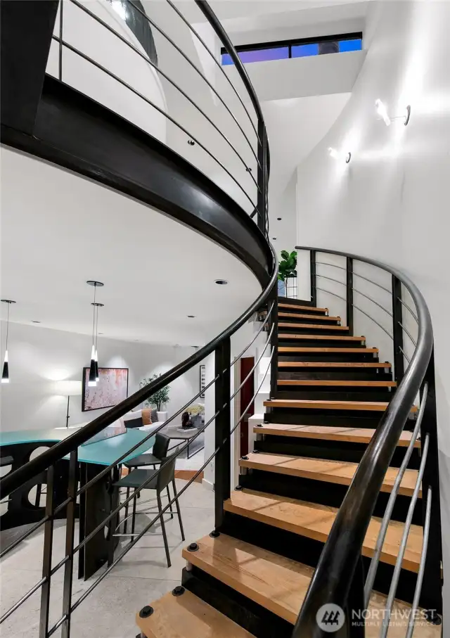 Floating steel staircase is the centerpiece of the home!