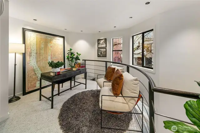 Upstairs bonus loft space ideal for guests or home office.