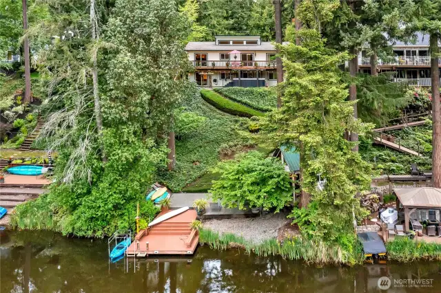 Waterfront home offering LOTS of comfortable living space on a park-like lot with patio, dock, and clubhouse.