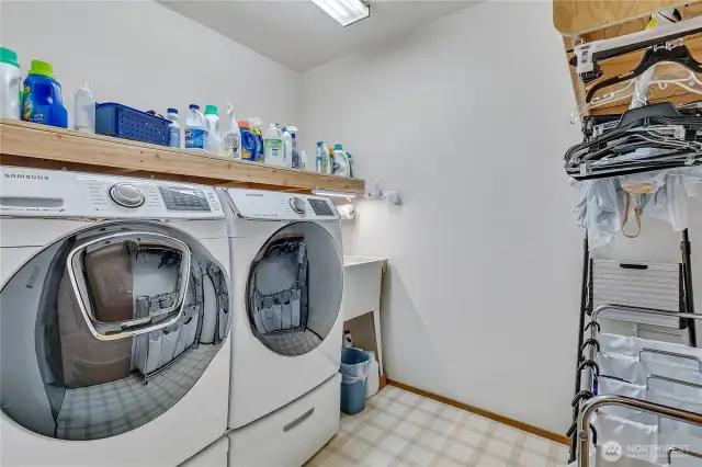 Laundry room with a convenient sink.