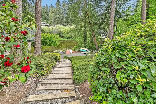 Lighted stairway leads down to serene lakefront living.
