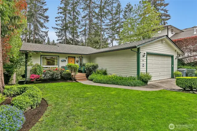 Enjoy year-round blooms and mature landscaping.