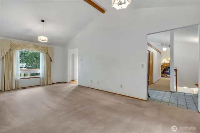 Impressive formal living and dining room with vaulted ceilings.