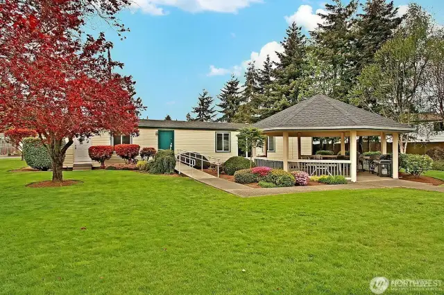 View the back of the club house. Gazebo and barbeque area for all residents to use and enjoy. Great setting for planed gathering, celebrations, private parties etc,