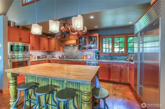 Kitchen is spacious with plenty of counter room and custom clear vertical grain Fir cabinets