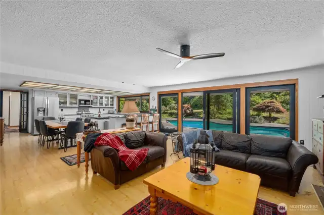 The great room before Great Rooms were fashionable.  This glorious room has new sliders to in-ground pool and your park-like backyard.