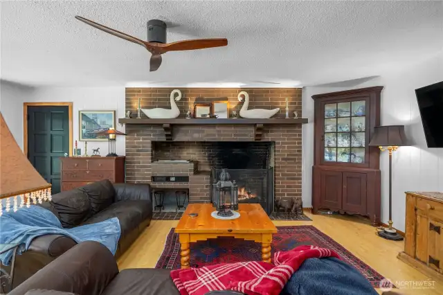This comfortable sitting area in front of the fireplace is where you will enjoy quiet evenings with friends and family.