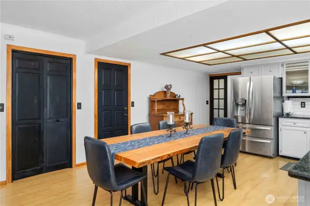Double doors to the pantry and the single door leads to the lower level