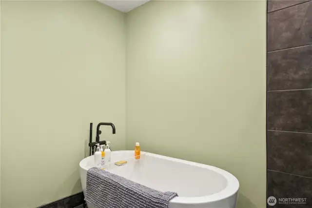 Stand alone soaking tub in second primary bedroom