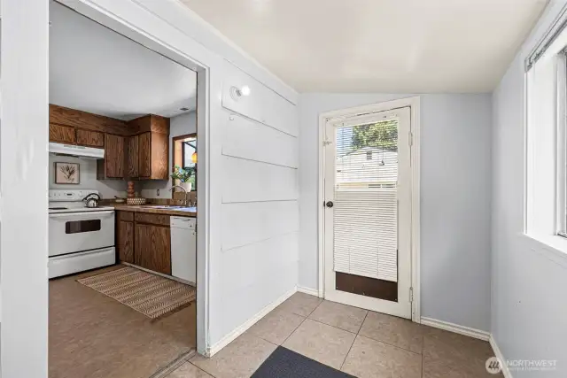 This mud room/utility room, added on well before our clients purchased the home, blends seamlessly with the original layout and adds valuable space and functionality to the heart of the home.