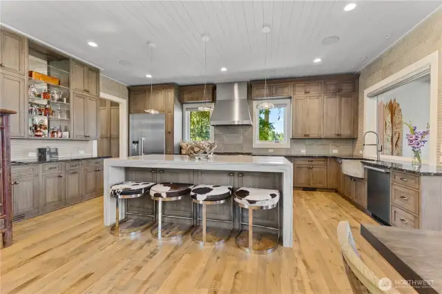 Large Kitchen with Cerused oak finish Plato custom cabinetry   Miele appliances – Large Island – eight burner range with double oven, warming drawer, dishwasher, refrigerator, freezer. Backsplash in kitchen is premium grade Italian tile