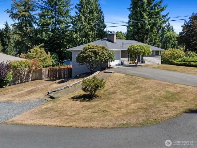 Another drive to the side w/ gate access.