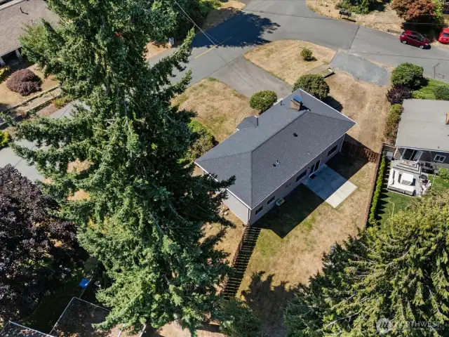 House is perched up a bit on the corner lot.