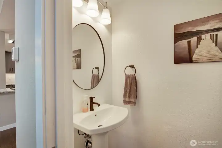 This newly added half bath is just off the living room.