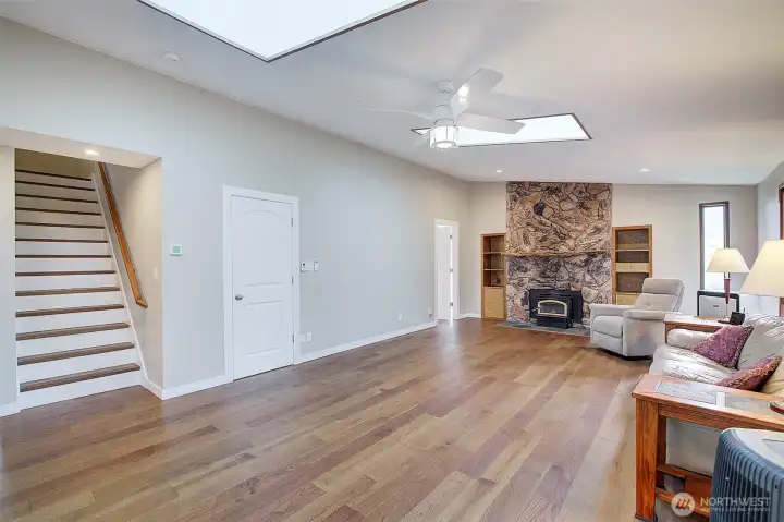 just off the living room are the stairs that lead to the upper floor.
